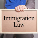a sign that reads immigration law a sign that reads immigration law