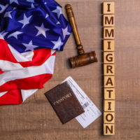 Us flag with immigration sign Us flag with immigration sign