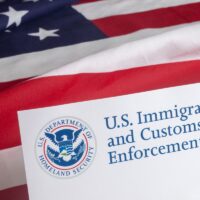 US Customs and Border Enforcement and USA flag