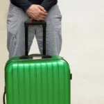 A man is waiting for deportation at the airport. Deporting of a foreign citizen. Voluntary departure and compulsory sending. Immigration and Emigration.Deport tourists.